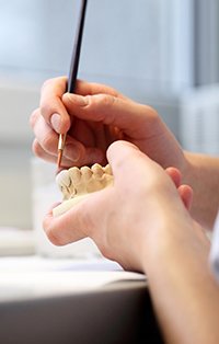 Dental lab work creating a diagnostic wax-up model