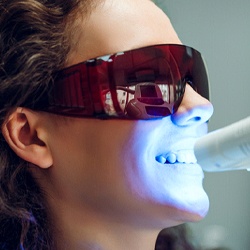 Woman receiving in-office teeth whitening in Southlake